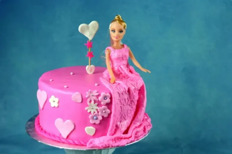 Elegant Barbie Cake with Intricate Fondant Dress and Floral Accents