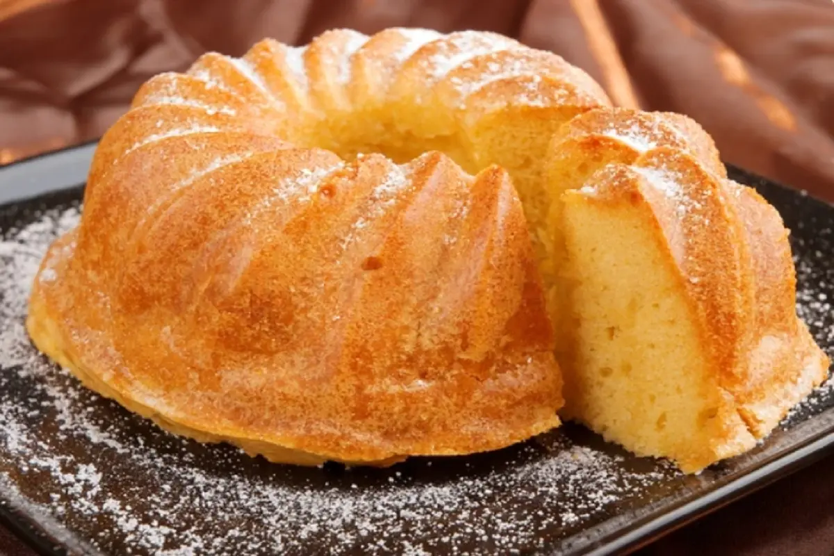 A freshly baked Bundt cake resting on a decorative platter.