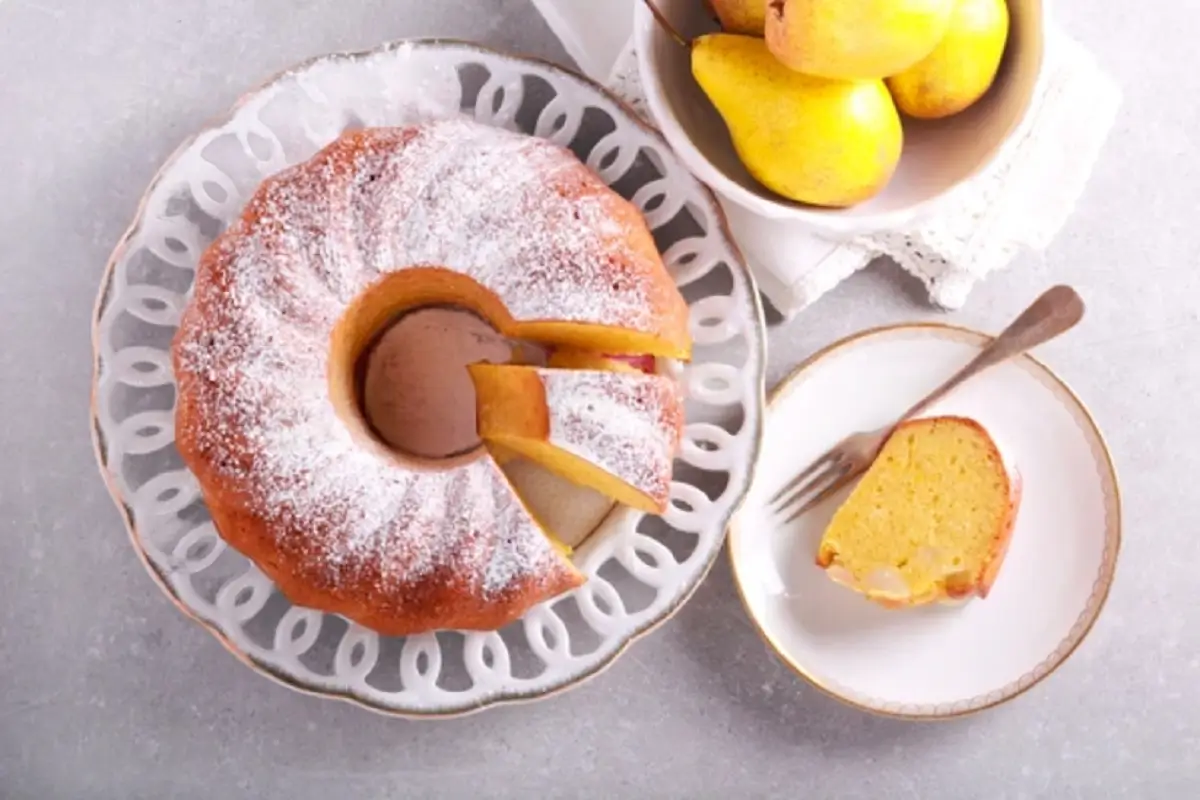 Perfectly baked Bundt cake displayed on a cooling rack with a golden brown crust and intricate fluted design