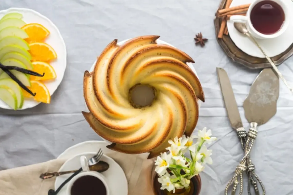 Text: Bundt pan filled with a freshly baked cake